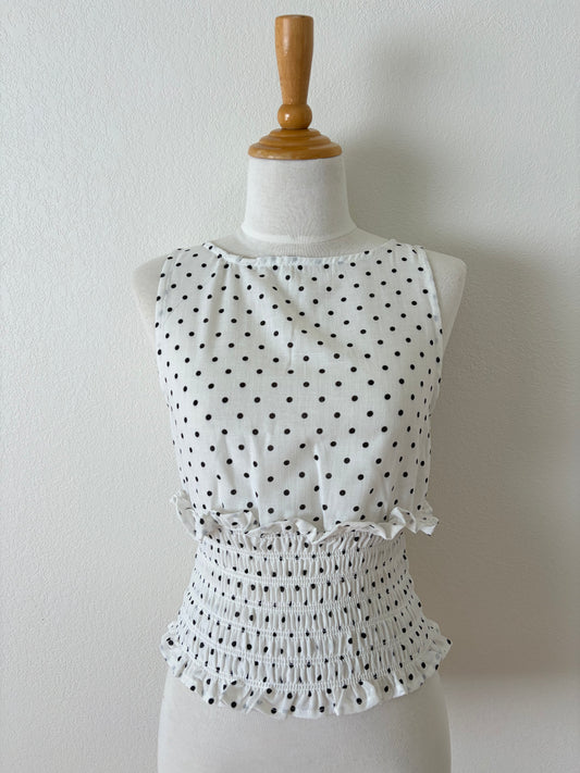 Top peplum fruncido de lunares